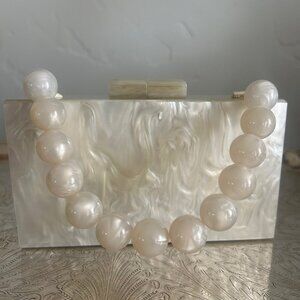 Beautiful, Unique, Never Used Feminine Pearl Clutch with Kiss Lock Closure.